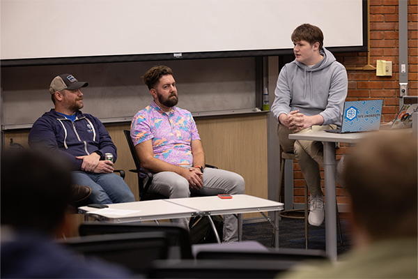 Dr. Austin O'Brien and Dr. Mark Spanier at a previous AI panel. 